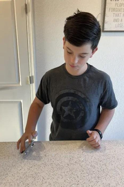 11-year-old breaks fingerboarding world record 11-year-old breaks fingerboarding world record