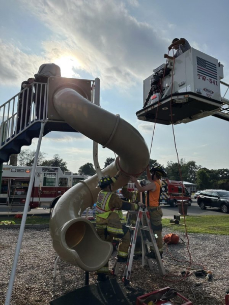 Firefighters rescue man wedged inside playground tube slide