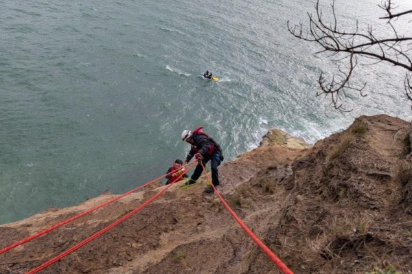 Firefighters rescue surfer stranded at base of cliff Firefighters rescue surfer stranded at base of cliff