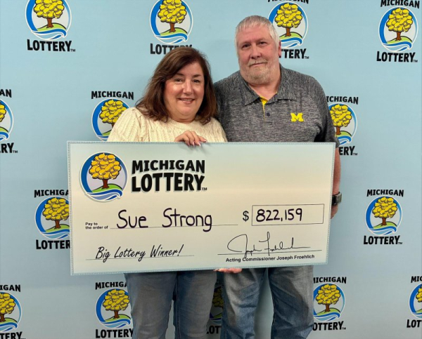 Michigan woman's pizza run leads to record-breaking lottery win