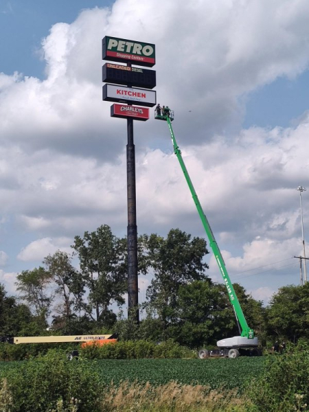 Trapped worker rescued from 130-foot-tall gas station sign